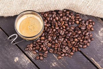 Top view of a cup of coffee on a rustic table
