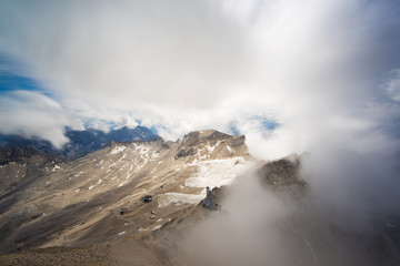 view in clouds from summit of the Zugspitze, at 2,962 meters above sea level, it is the highest mountain in Germany, Europe, long time exposure