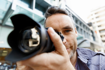 Male photographer taking picture