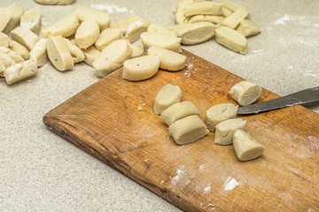 Fototapeta na wymiar Raw potato dumplings prepared for cooking.