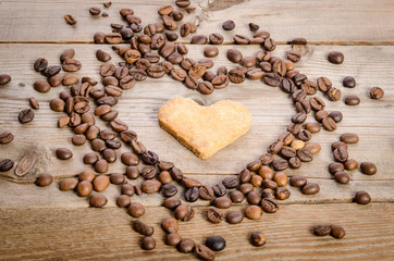 Frame- heart from coffee beans and cookies-heart  inside it on