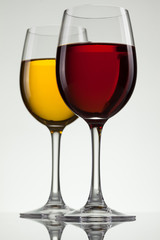 Glass of wine and bottle on white with copy space