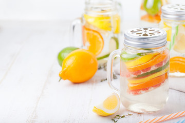 Detox fruit infused flavored water. Refreshing summer homemade lemonade cocktail Cleanse body and burn fat