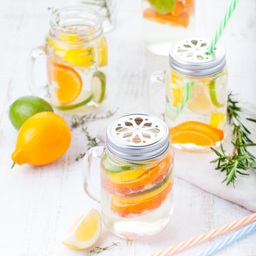Detox fruit infused flavored water. Refreshing summer homemade lemonade cocktail Cleanse body and burn fat