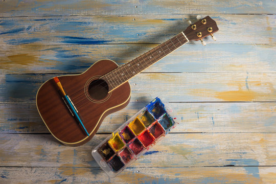 Ukulele with brush and color palette