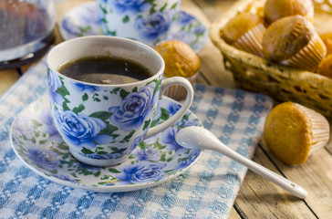 Cup of coffee, a muffin and the newspaper