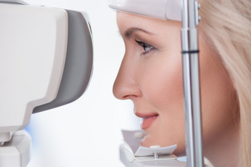 Pretty young woman is visiting eye doctor