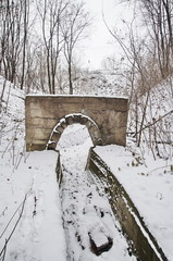 A photo of old stony watercourse in winter forest