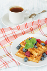 Breakfast with sweet waffles and coffee