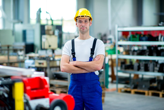 worker with helmet in factory