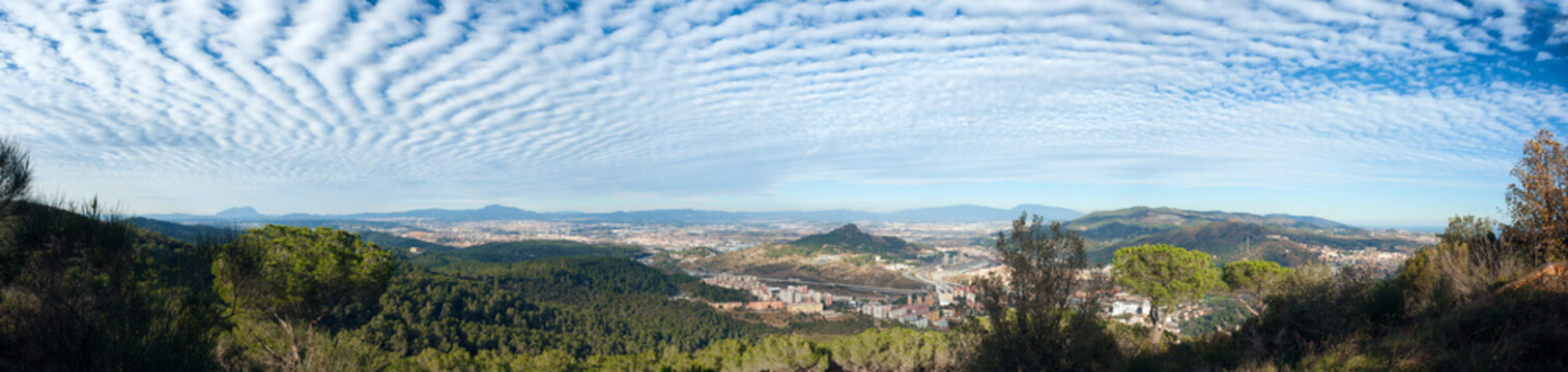 View of Cerdanyola. Striped cloudy sky. Barcelona, Catalonia, Spain.