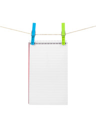 exercise book on a rope isolated on white