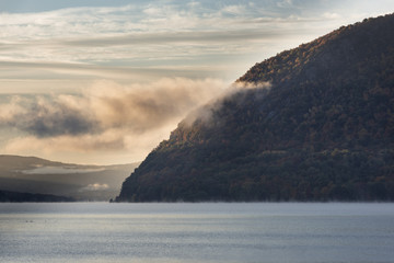 Dawn, Storm King Mountain and the Hudson River - The base of Storm King Mountain on the Hudson River in New York just as the sun starts to rise - 102072293