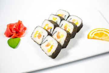 Salmon and caviar rolls served on a plate