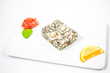 Salmon and caviar rolls served on a plate