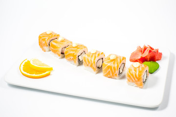 Salmon and caviar rolls served on a plate