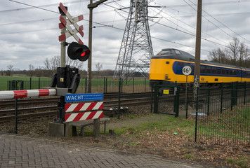 Train passing a railway crossing