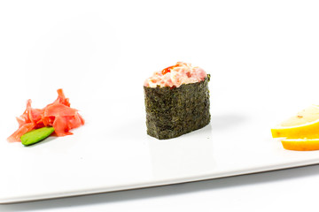 Salmon and caviar rolls served on a plate