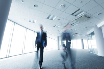 Fototapeta premium Blurry portrait of walking businessman