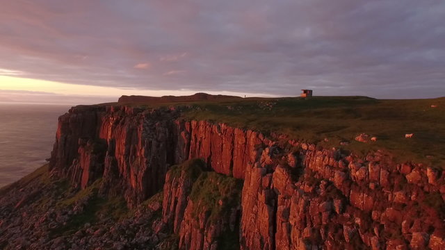 Stunning aerial shot along the coast on the Isle of Skye during a sunset
