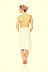 Fototapeta premium Young topless woman back after spa or bath.