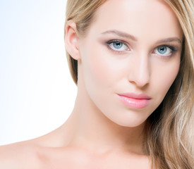 Fototapeta premium Beautiful and seductive young woman with pure skin on isolated b