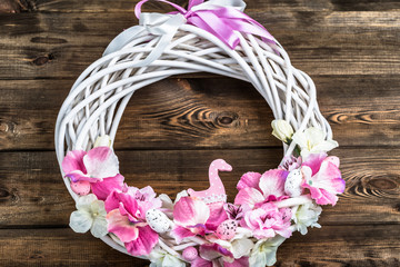 Easter wreath with easter eggs and flowers useful as easter decoration