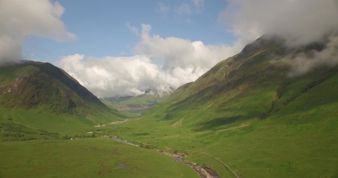 Beautiful aerial shot of Glencoe and Glen Etive in the Scottish highlands on a beautiful sunny day 
