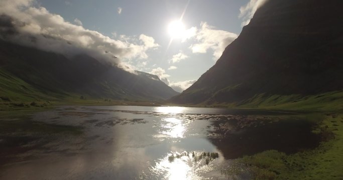 Beautiful aerial shot of Glencoe and Glen Etive in the Scottish highlands on a beautiful sunny day 

