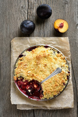 Fruit pie with fresh plums