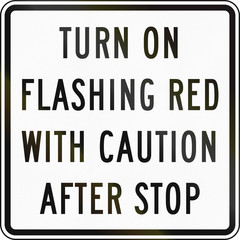 Road sign used in the US state of Delaware - Turn on flashing red