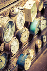 Vintage wooden wall with clocks