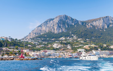Fototapeta premium Port of Capri, Italy. Pleasure boats go near breakwater