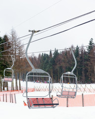 Fototapeta na wymiar Cable cars towards mountains with snow. Fujiten snow resort