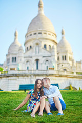 Romantic couple near Sacre-Coeur cathedral on Montmartre, Paris