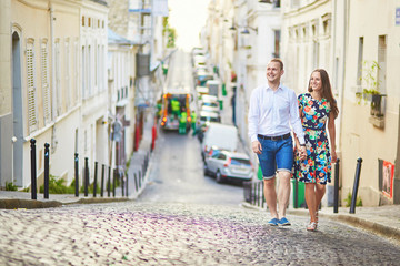 Young romantic couple walking on Montmartre