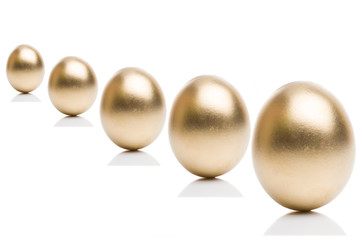 Golden eggs from  isolated on a white background.