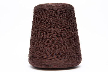 The cone of colored wool thread on a white background