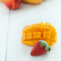 Cutted mango and fresh srawberry