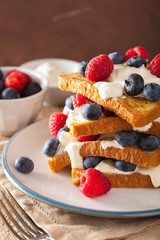 french toasts with creme fraiche and berries for breakfast