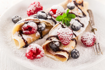 Tasty pancakes with fresh berries