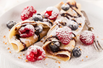 Tasty pancakes with fresh berries