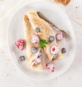 Tasty pancakes with fresh berries