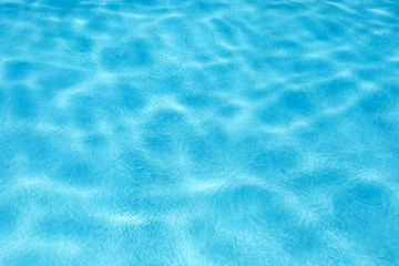 Fototapeta na wymiar Blue ripped water in pool