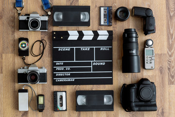 Old retro and modern equipment on wooden boards.
