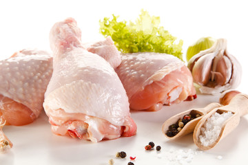 Raw chicken legs on white background