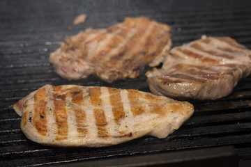 Frying beef steak on the grill