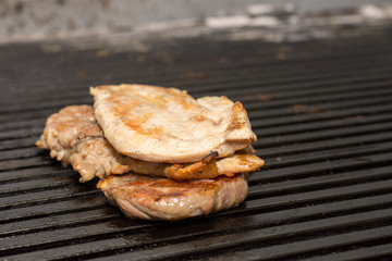 Frying beef steak on the grill