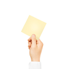 Hand holding square blank yellow sticker mock up isolated. 