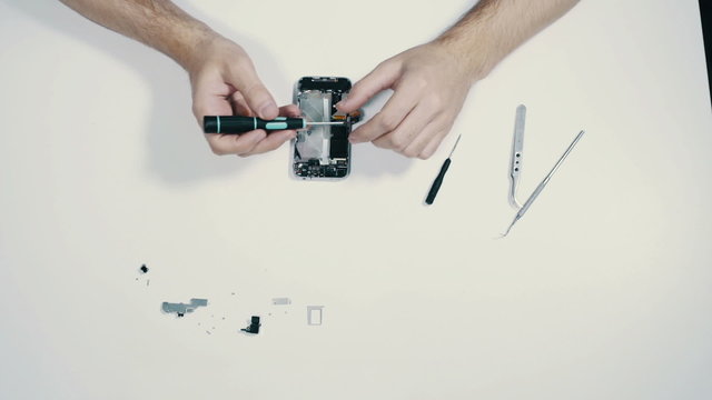 Smart phone disassembling, high angle view, point of view, time lapse